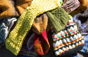 a pile of handknitted socks, www.bykaae.dk