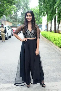 Actress Pooja Hegde Stills in black dress at Valmiki movie Press Meet