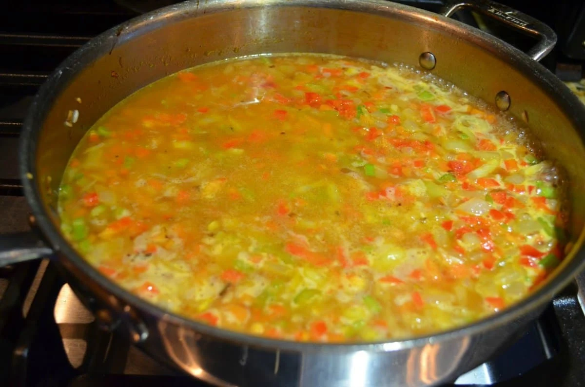 Restaurant Style Mexican Rice coming to a simmer.