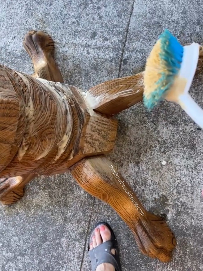 scrubbing oven cleaner on the pedestal