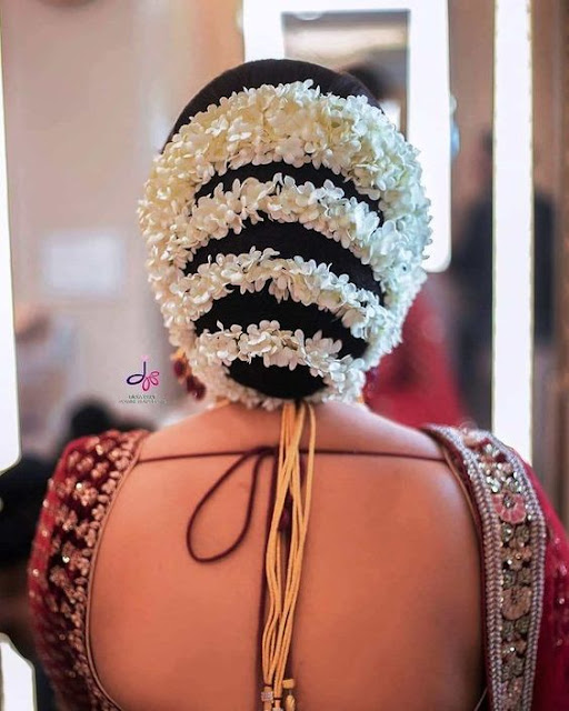 30+ Messy Bridal Bun Hairstyles with Flowers for Wedding - WallpaperDPs