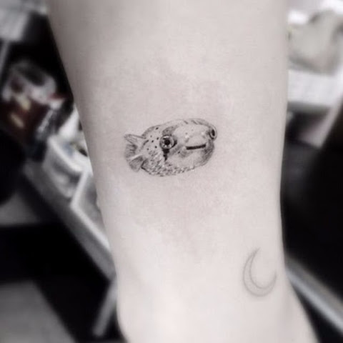 Miley Cyrus' Puffer Fish Tattoo Actually Has a VERY Special Meaning