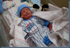 Landon enjoying his big boy crib and new found freedom