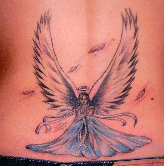 Angel girl tattoo with halo and large wings.