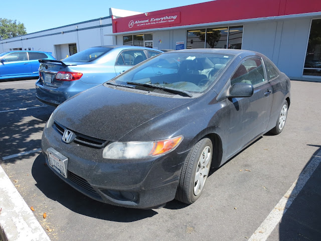 Honda Civic with badly faded paint.