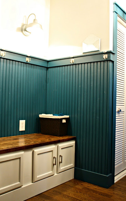 dark beadboard walls mudroom