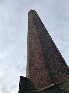 A photo looking up towards the sky with the stink vent pointing at an angle that makes it look slightly phallic or as the automatic descriptor called it, a photo of a gun.  Photograph taken by Kevin Nosferatu for the Skulferatu Project.