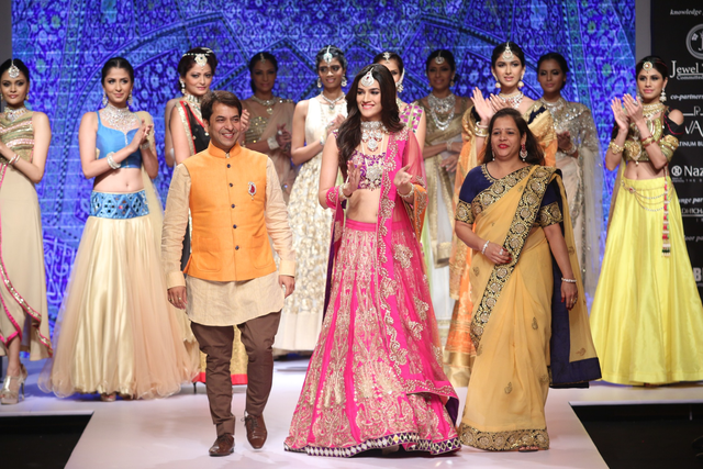 Kriti Sanon Traditional Fuchsia Pink Raw Silk Lehenga at IIJW 2015