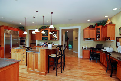 another angle of the red kitchen shows study space across the kitchen