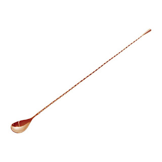 long copper spoon with twisted handle