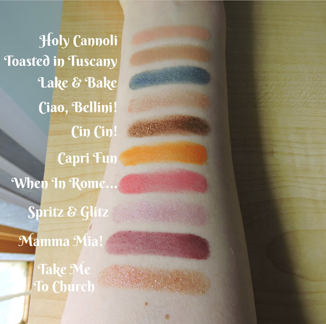 Swatches of 10 eyeshadows from Too Faced’s Italian Spritz Eyeshadow palette on Ultima Beauty’s arm. Text Reads: Holy Cannoli , Toasted in Tuscany,  Lake & Bake, Ciao, Bellini! , Cin! Cin! , Capri Fun, When in Rome… , Spritz & Glitz, Mamma Mia! , Take Me To Church”