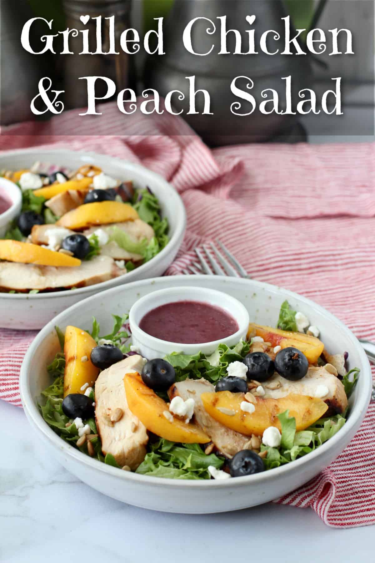 Grilled Chicken and Peach Mixed Green Salads in bowls.