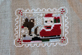 Frosted Pumpkin Stitchery - Santa cross-stitch