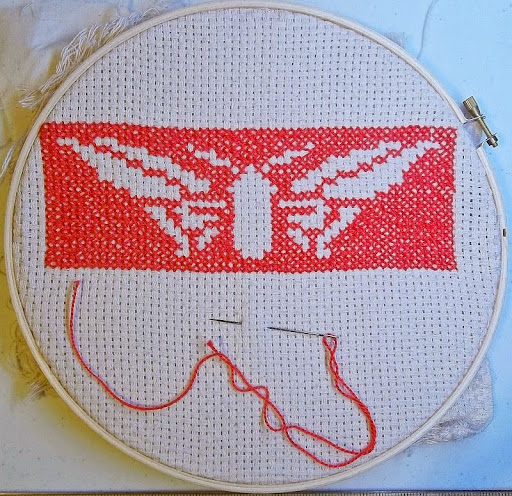 Assisi-style butterfly in red on white monk's cloth