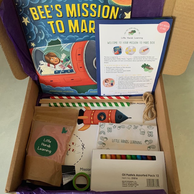 Space activity box, including a book, oil pastels, straws and roll of washi tape