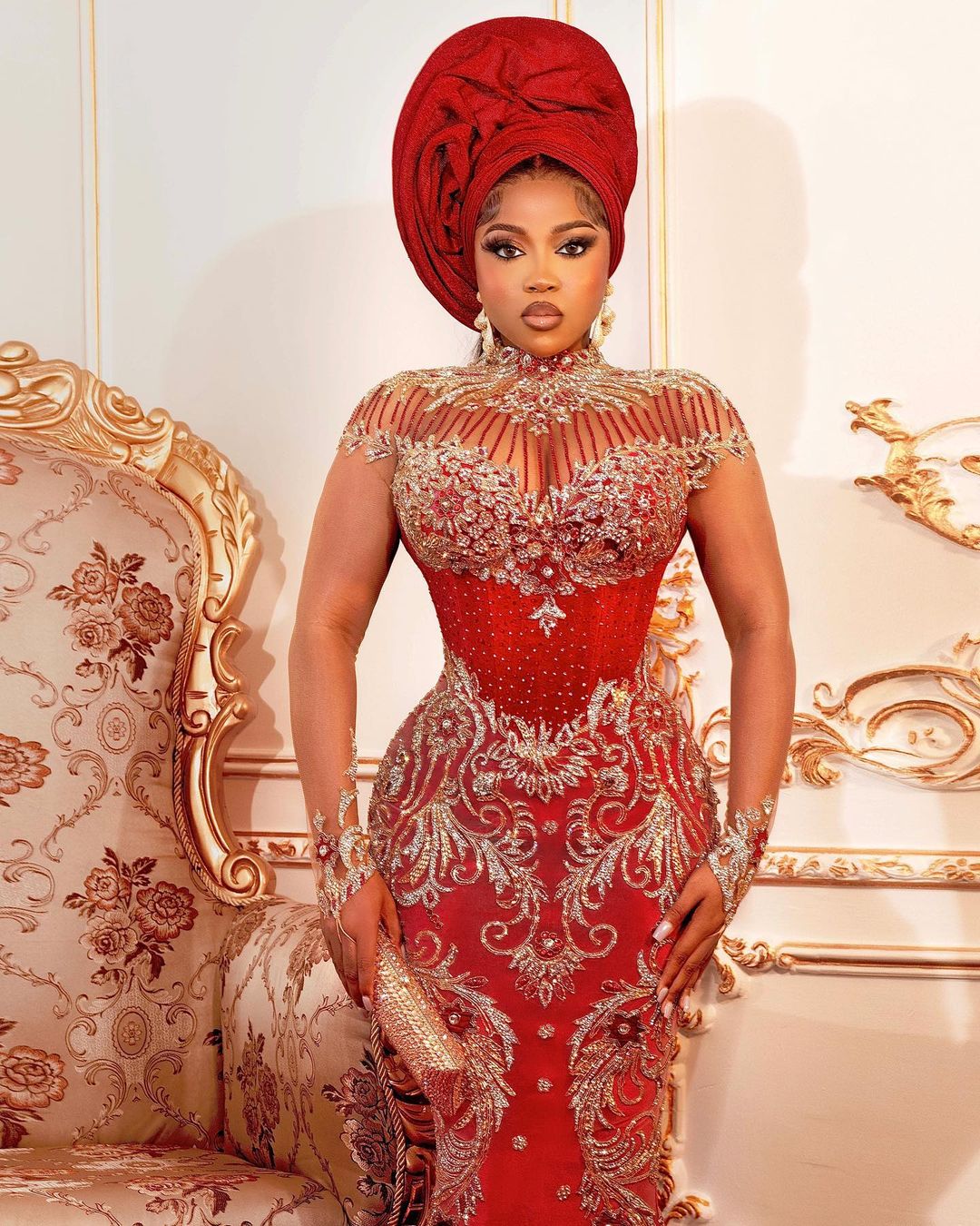 Veekee James in a stunning red bridal dress