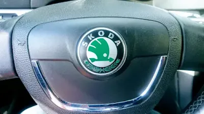old green skoda log on yeti steering wheel