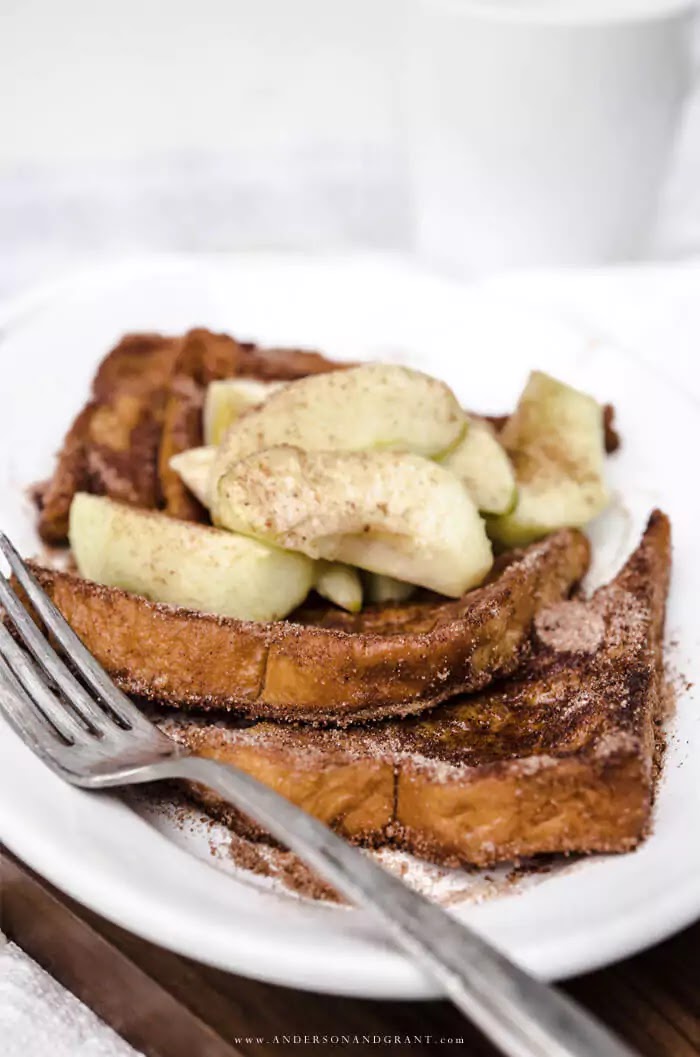 Stack of cinnamon french toast with caramelized apple slices