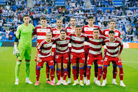 GRANADA C. F. Temporada 2023-24. Raúl Fernández, Gerard Gumbau, Víctor Díaz, Ignasi Miquel, Miguel Rubio, Lucas Boyé. Bryan Zaragoza, Sergio Ruiz, Myrto Uzuni, José Callejón, Carlos Neva. REAL SOCIEDAD DE FÚTBOL 5 🆚 GRANADA C. F. 3 Sábado 02/09/2023, 14:00 horas. Campeonato de Liga de 1ª División, LaLiga EASports, jornada 4. San Sebastián, Guipúzcoa, Reale Arena: 27.808 espectadores. GOLES: ⚽1-0: 9’, Take Kubo. ⚽1-1: 35’, Robin Le Normand, en propia puerta. ⚽2-1: 44’, Take Kubo. ⚽3-1: 59’, Martín Zubimendi. ⚽4-1: 67’, Ander Barrenetxea. ⚽5-1: 76’, Miki Bosch, en propia puerta. ⚽5-2: 83’, Lucas Boyé. ⚽5-3: 90+9’, Bryan Zaragoza.