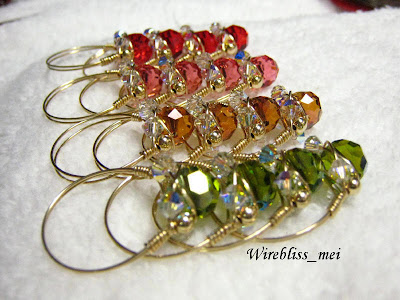 rows of wire wrapped sparkly crystal rings