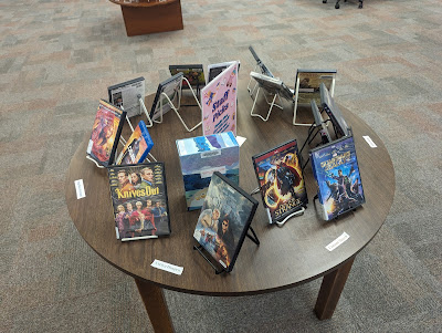 A table with staff picks for DVDs.