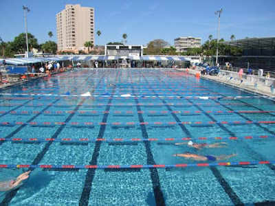 Olympic sized swimming pool outside.