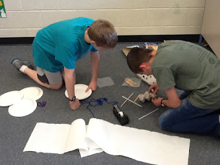 Two students working on a Mars lander project