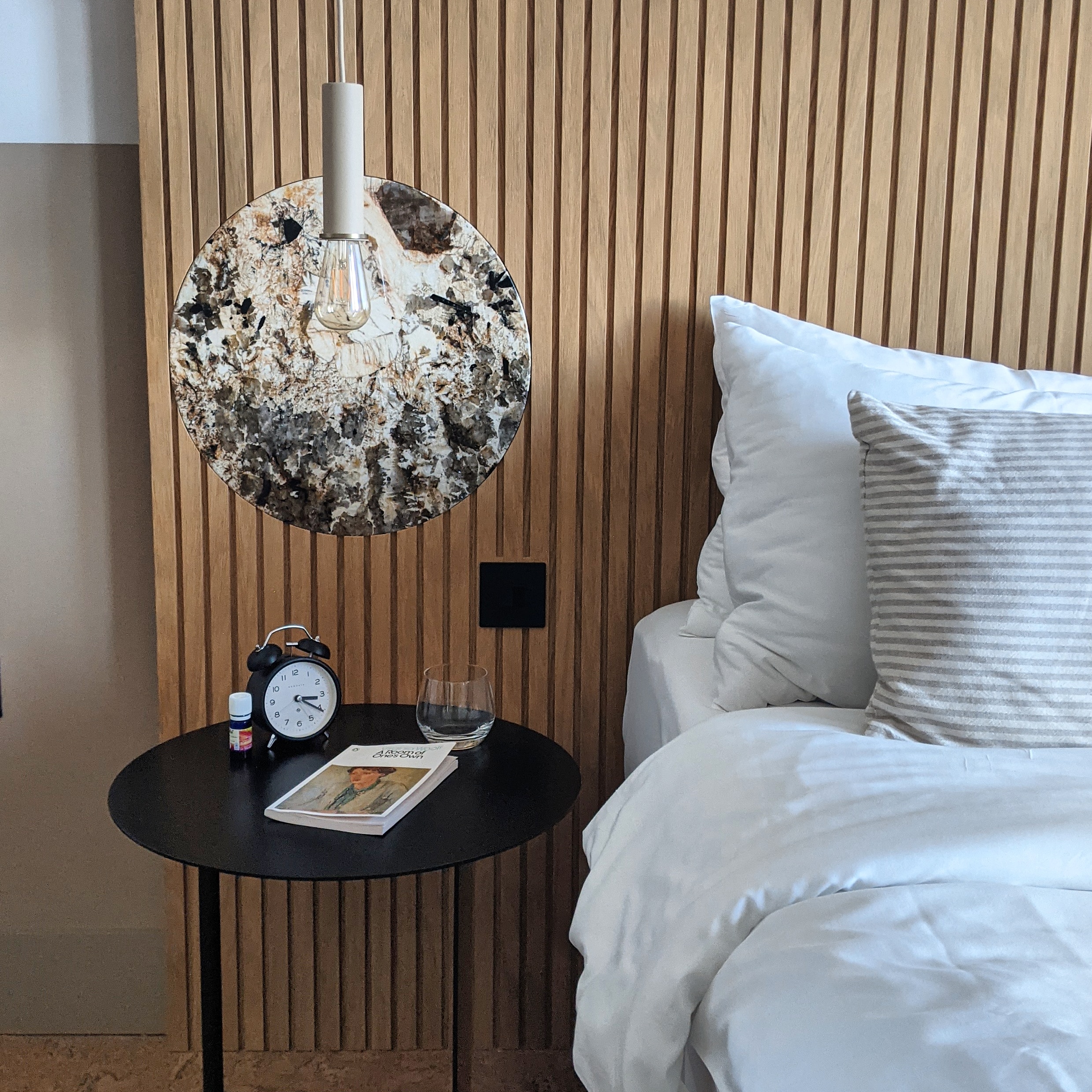 wooden slatted bedhead and bedside table details at port hotel in eastbourne