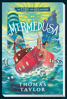 Small book cover. The Jaunty Spark fishing boat, painted red with its wind turbine mast and monster tusk on the prow, is on the high seas near the Eerie lighthouse. The lighthouse is to the left, and a large rock points up to the right with the boat in between. The Mermedusa is seen as a pale grey-blue image against a yellowing sky, without detail. Its hair radiates outward like tendrils. Violet stands pointing to the right as viewed, and Herbie looks aghast to the left at the monster whose blurred image we can see beneath the surface of the water. The ocean is a blur of greens, blues and grey. The sky is a wavy blue and yellowy green. Mermedusa is written in white capitals over the boat. The author's name appears. at the bottom of the page in white, and "An Eerie-on-Sea mystery" is along the top of the book – yellow writing on a blue background.