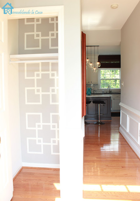 closet makeover with taped geometric design on wall