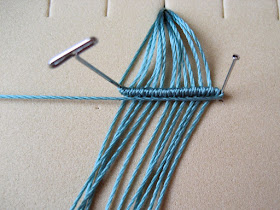 Straight pins and t-pins used to hold micro macrame knotting in place