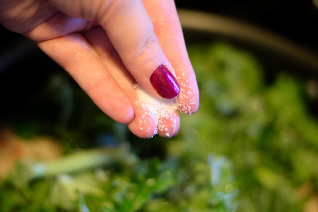 Salt being added to the pan. 