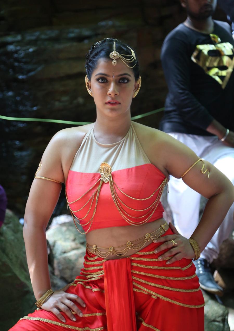 Actress Varalaxmi Hot Photoshoot in Orange Dress