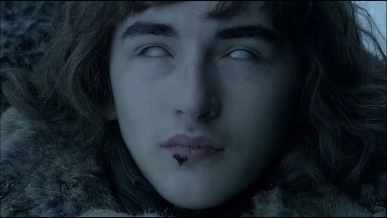 Bran Stark immersed in a mystical vision, surrounded by visions of past and future events