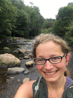 Me smiling in front of a river.