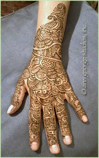 intricate henna tattoo back of hand
