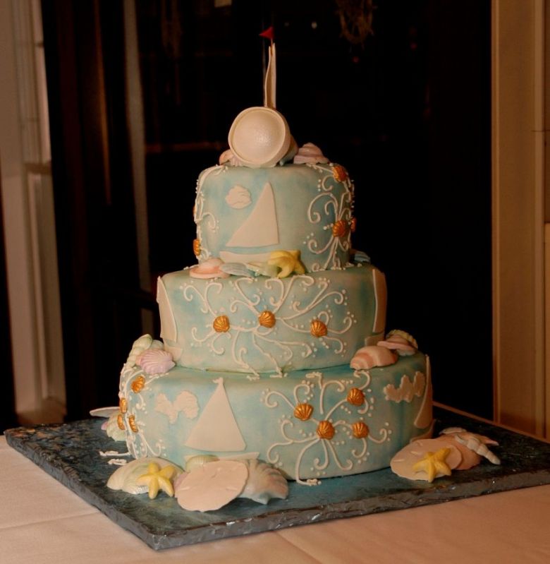 Light blue three tier round wedding cake in light blue with nautical theme