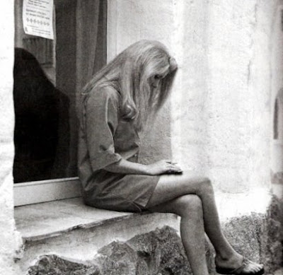 Catherine Deneuve reading on Sardinia photograph Nello Di Salvo via Vogue