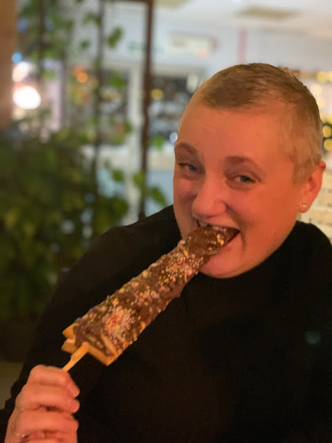 madmumof7 eating bubble waffle on a stick