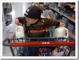 The only thing I thought about when I grabbed the milk was that the cart was full, and since Reid was wearing a coat, he won’t get too chilly in the time it takes for me to walk to the checkout.  I should have guessed…