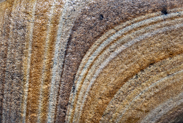 Photo of patterns on a wet pebble found on the beach at Maryport