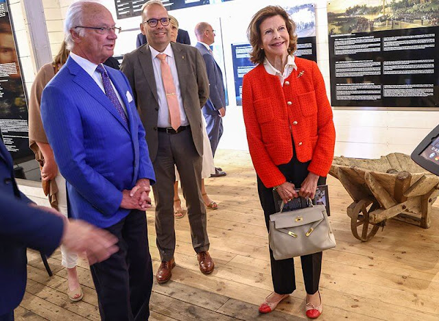 Queen Silvia wore a red tweed jacket by Chanel, and red and beige leather ballerina flats by Chanel. Pretty Ballerinas
