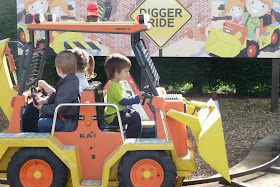 Our toddler on the Digger ride at Peppa Pig World, Paultons Park