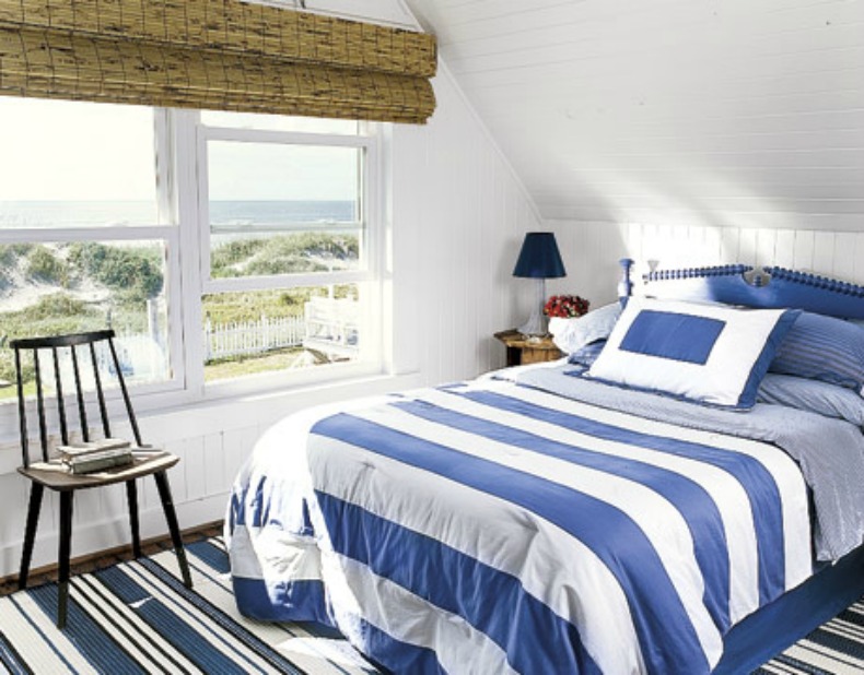 ... stripe bedding gives this simple, coastal bedroom a Nautical touch