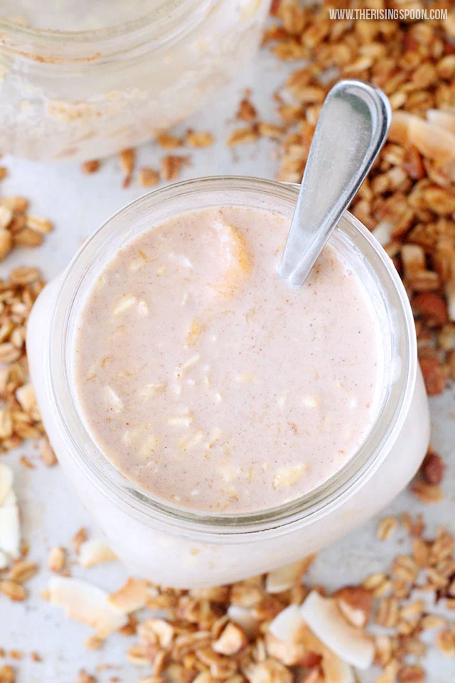 An easy & healthy recipe for creamy mango overnight oats made with as little as six ingredients like rolled oats, milk (dairy or non-dairy), real maple syrup, and fresh or frozen mango (which is full of vitamin C + A & fiber). A mere five minutes (or so) of prep the night before gives you healthy grab-and-go breakfasts for days.