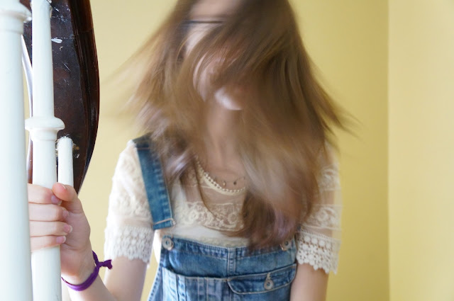 Denim overalls, lace shirt, crazy hair