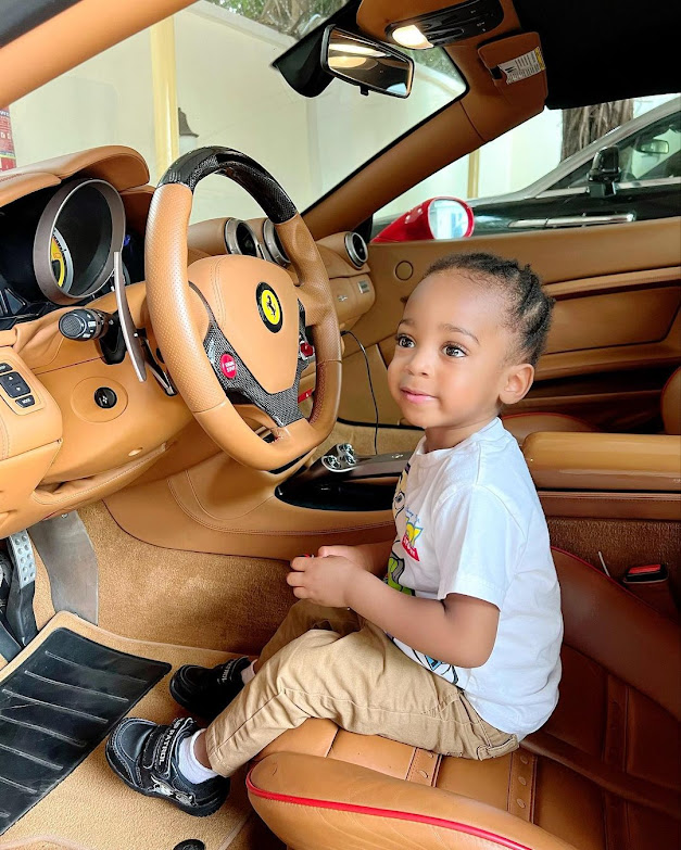 Actress Regina Daniels shares photos of her son as he takes a ride in his dad's ferrari (Photos)
