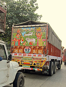 painted scene on back of truck in India