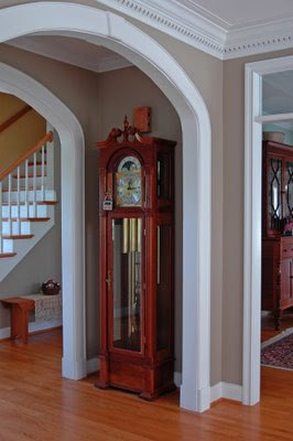 overall view of the cherry grandfather clock in the front hallway