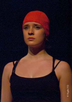 Posted by Ripple (VJ) : Performance by Leipziger Tanztheater @ Kamani, Delhi : As far as I was able to decipher the meaning of the performance, this dancer was portraying our resistance against growing up and letting our childhood go. The red skull cap was used to symbolize childhood and long, lose hair symbolized womanhood. It was very touching. Beautiful expressions and performance. 